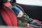Close Up caucasian cute baby boy sleeping in modern car seat. Child traveling safety on the road. Safe way to travel