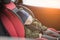 Close Up caucasian cute baby boy sleeping in modern car seat. Child traveling safety on the road. Safe way to travel