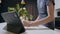 Close up caucasian male chopping vegetables looking at digital tablet for recipe