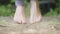 Close-up of caucasian male feet jumping barefoot on skipping rope