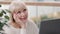 Close-up caucasian pensive woman sitting at office desk with laptop dreamy female writer businesswoman taking break at