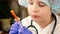 Close-up Caucasian Preschooler Boy in Doctor\\\'s Uniform Plays Home Pharmacy Preparing Medicine