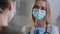 Close-up caucasian woman doctor cardiologist therapist gynecologist ophthalmologist in medical mask and gloves consults