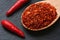 Close up of cayenne pepper in wooden spoon