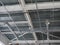 A close-up of a ceiling in a huge shopping centre. Inside view of iron structure construction as a background. Industry