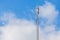 Close up Cellular transmitter, dipole antenna for telecommunications with clear blue sky background.