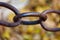 Close up of chain link on blurred background. Conceptual modern symbol