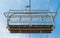 Close up of a chair on a ski lift viewed from below