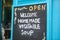 Close-up chalk board with an invitation to vegetable soup, selective focus