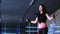 Close-up charming cute slim brunette woman athlete jumps on rope training in gym for boxing