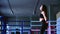 Close-up charming cute slim brunette woman athlete jumps on rope training in gym for boxing
