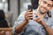 Close up of Cheerful businessman uses mobile smartphone