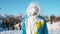 CLOSE UP: Cheerful Caucasian guy snowboarding in Slovenia gets hit by a snowball
