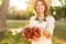 Close up of cheerful young girl in summer hat spending time at the park