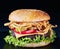 Close-up of Cheeseburger on a black stone board