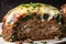 Close-Up of Cheesy Meatloaf Stuffed with Mushrooms and Spinach