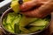 Close up of chef making organic cucumber salad