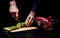 Close up of chef mans hands chopping vegetables