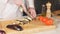 Close-up of a Chef Masterfully Cutting Colorful Vegetables on Cutting Board. Tomatoes and Mushrooms