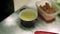 Close up of chef pouring a cheese soup with ladle