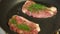 Close-up of a chef puts pork chops in frying pan.