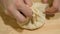 Close up of chef in the restaurants` open kitchen preparing dough for traditional ossetian pie