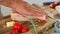 A close-up of a chef rubbing butter into a piece of meat