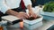 Close-up: The chef is serving ratatouille in a bowl. The process of preparing food in a restaurant