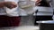 Close-up of a chef sifting cornmeal in the kitchen of a Italian pizzeria.