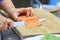 Close up. chef slicing fish for sushi