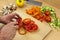 Close up of a chefs hands ring slicing a red bell pepper