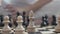 Close-up of chess on a chessboard, white pieces in focus