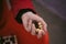 Close up of chess pieces in hand of unrecognizable woman. Unknown female holds figures of chess in her hands