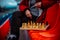 Close up of chess on stadium bleacher. Body part of unrecognizable woman playing in board game in cold weather.