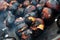 Close-up of chestnuts roasting in a pan on open fire