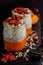 Close up of chia seed pudding with goji berries, smashed fresh apricot and oat meals
