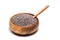 Close up of chia seeds Salvia hispanica and wooden spoon in a round wooden bowl on isolated background.