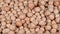 Close up chickpea beans falling on wooden table