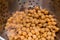 Close up of chickpeas being rinsed under a running tap