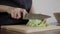 Close up of chief woman making salad healthy food and chopping lettuce on cutting board