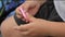 Close-up child boy hands playing with popular anti-stress toy pop it