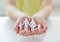 Close up of child hands with paper family cutout