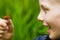 Close-up of child holding a butterfly