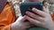 Close-up of a child playing with a smartphone, very close-up of hand and mobile phone