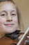 Close up of a child playing violin on isolated light background. Portrait of girl with string and playing violin. Portrait of the