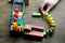 Close-up of child`s hand builds lines of dominoes, colored cubes of dominoes fall one after another, the concept of domino effect