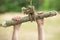Close up of child`s hand on a homemade swing in the forest.