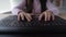 Close-up of a child\'s hand typing text on the keyboard. Webcam viewing. Prints with your fingers.