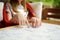 Close-up on child`s hands assembling a jigsaw puzzle on a table