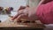 Close-up of a child\'s hands decorate Christmas, ginger, cookies for the holiday. Gingerbread patterns